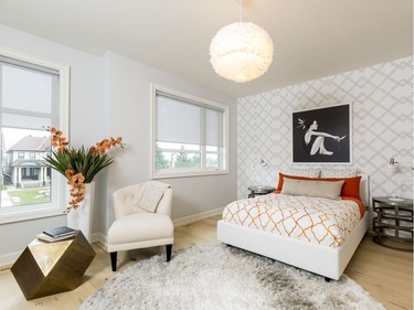 Girl’s room: Although still grounded in black and white, ‘I love that it’s fresh and airy, with that vibrant hit of orange,’ associate designer Tracey Woodman says of the girl’s room.
