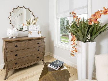 Girl’s room: Although still grounded in black and white, ‘I love that it’s fresh and airy, with that vibrant hit of orange,’ associate designer Tracey Woodman says of the girl’s room.