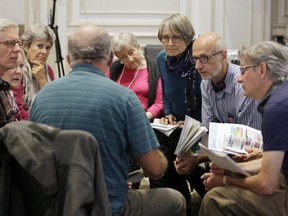A group of people discuss ideas during a federal electoral reform community dialogue at the Crowne Plaza Gatineau on Sept. 15, 2016.