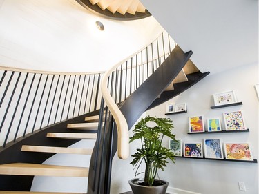 Staircase: A key feature is the curved staircase that spans all three floors. Pulled away from the wall and with open risers and oak treads supported by matte black stringers mimicking a wrought iron look, it provides a sculptural effect in the centre of the home. ‘For me, the staircase is always a pretty big feature in the dream homes,’ says designer Donna Correy. ‘If it can become a great feature, it’s one of the first ones I look to, to dressing up.’ Dressing this one up meant rearranging the mud room and back hall to create enough space for it.