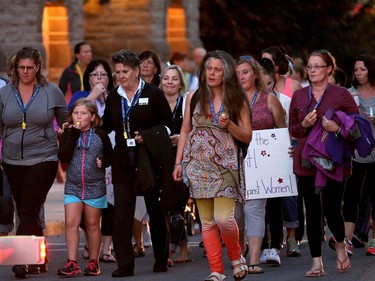 About 40 people came out for the Lanark Take Back the Night March Wednesday (Sept. 21, 2016) in Carleton Place.  Although the event is primarily focused on violence against women, amongst the speakers was Catherine Cameron, whose husband and former councillor, Bernard Cameron, was killed in February by their daughter's ex partner.  Before the march, 19 roses (including one for Bernard) were dropped into the Mississippi River in honour of women who had been killed in the area, including the three women murdered near Wilno last year on Sept. 22, 2015. Julie Oliver/Postmedia