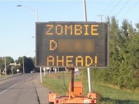 A hacked traffic sign on Hazeldean Road has a zombie warning for motorists. Part of the message has been hidden by the Citizen.