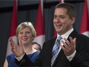 Jill Scheer looks on as her husband, Conservative MP Andrew Scheer, responds to a question after announcing he will run for the leadership of the Conservative party Wednesday September 28, 2016 in Ottawa.
