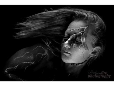 Artist May Mutter created this lightning painting on Meagan Potter. Both women have suffered serious concussions. (Lisa Murdock-Tolmie, Lady on Fire Photography)