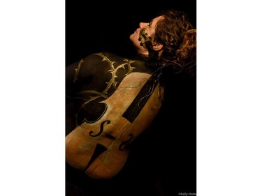 Artist May Mutter created this violin painting on Mary Baumer. Both women have suffered serious concussions. (Kelly Hotte Photography)