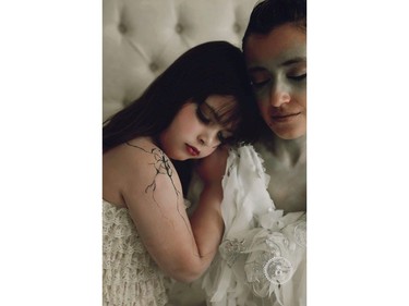 Artist May Mutter has painted six-year-old Samantha Kelly-Bader, who suffered a concussion, as a broken porcelain doll. Samantha's mother, Sophia Kelly, is her protective guardian angel. (Shanna Dukelow DaSilva, Shanna DaSilva Photography)