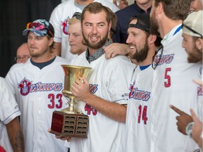 Austin Chrismon holds the cup as the Ottawa Champions are given a heroes welcome at Ottawa City Hall following their victory in the Can-Am League Championship over the weekend.   Wayne Cuddington/ Postmedia