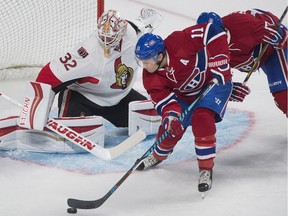 Montreal Canadiens' Brendan Gallagher (11) moves in on Ottawa Senators goaltender Chris Driedger during first period NHL pre-season hockey action in Montreal, Thursday, September 29, 2016.