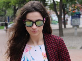 Caroline Budd walks to the Ottawa courthouse on Monday, Aug. 31, 2015 on the first day of her sex assault trial.