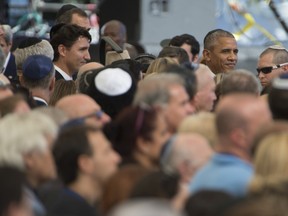 Prime Minister Justin Trudeau stands behind United States President Barack Obama at the start of the state service for former Israeli President Shimon Peres in Jerusalem.