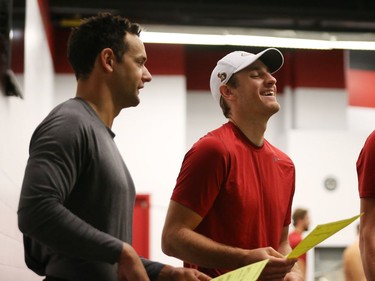 Clarke MacArthur (L) and Kyle Turris of the Ottawa Senators share a laugh during the first day of training camp.