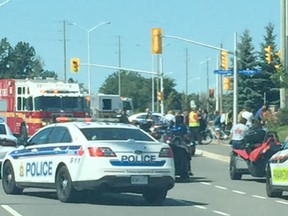 First responders tend to motorcyclists injured in a crash near Innes and Trim roads Saturday.