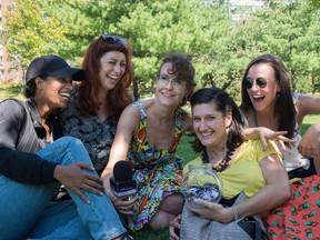 The Ghomeshi Effect project team takes a break while interviewing people on the street. Mekdes Teshome, performer (pictured left), Amelia Griffin, choreographer (pictured second from left), Leah Archambault, performer (pictured centre), Jessica Ruano director/producer (pictured second from right), and Jessa Millar, friend of the show (pictured right).