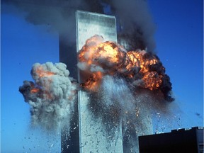 (NYT20) NEW YORK -- Sept. 11, 2001 -- TERROR-RDP-20 -- A fire ball erupts from the upper floors of the south tower of the World Trade Center after a second plane hit the complex, Tuesday. (Kristen Brochmann/The New York Times) *LITE