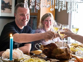 Veteran executive chef Michael Blackie with his wife, Jillian, toast an early Thanksgiving meal at home in Kanata with their children.