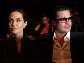 (FILES) This file photo taken on June 13, 2014 shows US actress and special UN envoy Angelina Jolie (L) and her husband US actor Brad Pitt attending the fourth day of the Global Summit to End Sexual Violence in Conflict in London. US actress Angelina Jolie has filed for divorce from her husband Brad Pitt after two years of marriage and 12 years together, announced on September 20, 2016 by the website TMZ celebrity. /