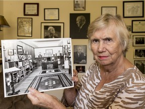 Landon Pearson, the daughter-in-law of former prime minister Lester B. Pearson, holds a photo of the 'Pearson Collection' that was once displayed in Laurier House. (Errol McGihon/Postmedia)