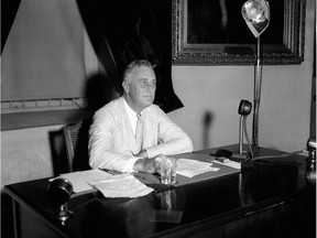 This July 24, 1933 file photo shows U.S. President Franklin D. Roosevelt addressing the nation via radio.