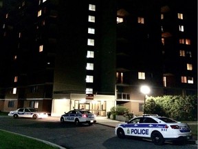 Ottawa police cruisers are parked outside an apartment building on McWatters Road on Saturday, Sept. 24, 2016.
