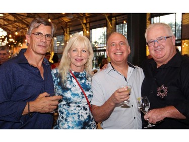 From left, Clayton Kennedy with guests Kathy Godding, Ian Engelberg and his husband Joseph Cull at a party that Kennedy's wife, well-known businesswoman Sheila Whyte hosted at the Horticulture Building on Friday, September 9, 2016, to celebrate the 25th anniversary of Thyme & Again Creative Catering and Take Home Food Shop. (Caroline Phillips / Ottawa Citizen)