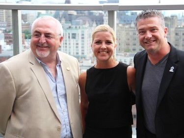 From left, Kanata South Coun. Allan Hubley with Jenny Tierney and her husband, Beacon Hill-Cyrville Coun. Tim Tierney, on the rooftop lounge during the grand opening party held Wednesday, September 7, 2016, for Andaz, a new luxury hotel in the ByWard Market.