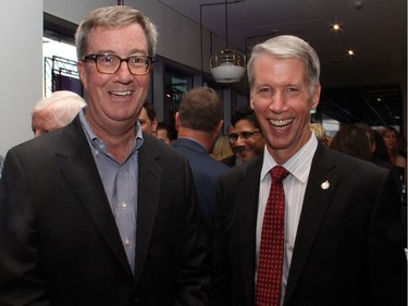 From left, Ottawa Mayor Jim Watson with Chief Government Whip Andrew Leslie, Liberal MP for Orleans, at the grand opening party for the new Andaz luxury hotel in the ByWard Market, held Wednesday, September 7, 2016.