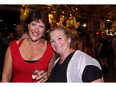 From left, Sheila Whyte with Catherine O'Grady, executive producer of the TD Ottawa International Jazz Festival, at a party Whyte threw at the Horticulture Building on Friday, September 9, 2016, to celebrate the 25th anniversary of her popular Ottawa business, Thyme & Again Creative Catering and Take Home Food Shop.