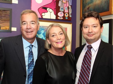 From left, Wes Rafuse, owner of sponsor Centennial Glass, with PAL Ottawa board member Catherine Lindquist, executive director at Council of Heritage Organizations in Ottawa, and lawyer Claudius Croiset at PAL Ottawa's benefit soirée, held at Cube Gallery on Thursday, September 29, 2016.