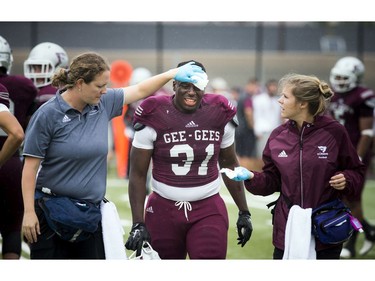 The Gee-Gees' Shako Dimanche leaves the field injured.