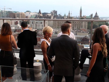 Guests mingled on the outdoor rooftop patio overlooking the city at the grand opening party held Wednesday, September 7, 2016, for the new Andaz luxury boutique hotel in the ByWard Market.