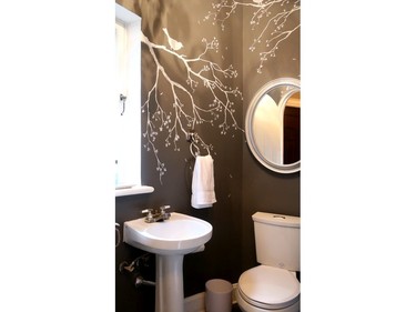 - Hand-painted branches decorate a small powder room after failing to master wallpaper around corners and edges. Tara Tosh Kennedy is a local artist who has restored a dilapidated heritage home, filling it with her own original paintings and creatively-presented family treasures.