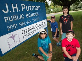 From left, Hari Adnani, 11,  Erin Childs, 11, Jonas Wright, 12, and Dominick Martin, 11, all attending J.H. Putman, a middle school that the public school board is recommending be closed. These kids and their parents want the school to remain open.