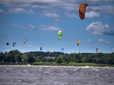 High winds brought the kiteboarders and windsurfers out to the Ottawa River just out from Britannia Beach Sunday September 11, 2016.   Ashley Fraser / Postmedia