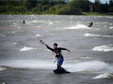 High winds brought the kiteboarders and windsurfers out to the Ottawa River just out from Britannia Beach Sunday September 11, 2016.   Ashley Fraser / Postmedia