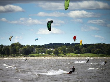 High winds brought the kiteboarders and windsurfers out to the Ottawa River just out from Britannia Beach Sunday September 11, 2016.   Ashley Fraser / Postmedia