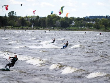 High winds brought the kiteboarders and windsurfers out to the Ottawa River just out from Britannia Beach Sunday September 11, 2016.   Ashley Fraser / Postmedia