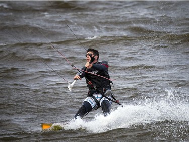 High winds brought the kiteboarders and windsurfers out to the Ottawa River just out from Britannia Beach Sunday September 11, 2016.   Ashley Fraser / Postmedia