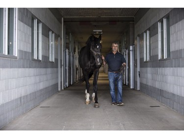 John Phillips will be retiring as the Farm Manager for the R.C.M.P. Musical Ride Branch. John with Stallion "High Spirits".