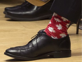 Prime Minister Justin Trudeau wears red and white maple leaf socks to his first First Ministers meeting at the Museum of Nature Monday, November 23, 2015 in Ottawa.