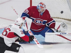 Ottawa Senators' Matt Puempel (26) scores against Montreal Canadiens goaltender Mike Condon during first period NHL pre-season hockey action in Montreal, Thursday, September 29, 2016.