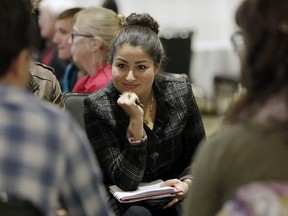 Minister of Democratic Institutions Maryam Monsef listens to a group discussion during a federal electoral reform community dialogue at the Crowne Plaza Gatineau on Sept. 15, 2016.