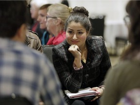 Minister of Democratic Institutions Maryam Monsef listens to a group discussion during a federal electoral reform community dialogue at the Crowne Plaza Gatineau on Sept. 15, 2016.
