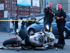 A white motorcycle and a Range Rover after a collision on George Street Friday.