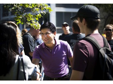 MP Yasir Naqvi greet people taking part in the annual Ottawa Labour Day Parade to celebrate working people Monday September 5, 2016.