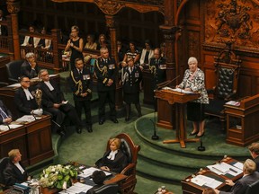 Ontario premier Kathleen Wynne along with Lieutenant Governor of Ontario, The Honourable Elizabeth Dowdeswell entre the Ontario Legislature at Queens park for the reading of the Throne Speech on Monday September 12, 2016. Dave Thomas/Toronto Sun/Postmedia Network