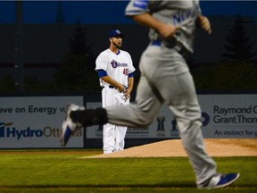 Ottawa Champions starting pitcher #40 Austin Chrismon stands as Rockland Boulders player runs past him after scoring a homerun during the game one of the Can-Am league final at Raymond Chabot Grant Thornton stadium on Tuesday, Sept. 13, 2016.