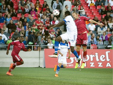 Ottawa Fury FC Lance Rozeboom fights FC Edmonton Tomi Ameobi for the ball.