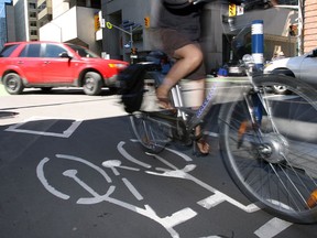 Cyclists using the bike lanes on Laurier Avenue.