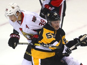 Ottawa's Andreas Englund ties up Pittsburgh's Jake Guentzel during an afternoon game of the rookie tournament at Budweiser Gardens in London, Ont. on Saturday, Sept. 17, 2016. Englund was frustrating the Penguins with his physical play.