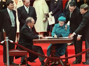 The Queen signs Canada's constitutional proclamation in Ottawa on April 17, 1982 as Prime Minister Pierre Trudeau looks on. It took much consensus-building –including among members of a key House of Commons committee – to reach this day.